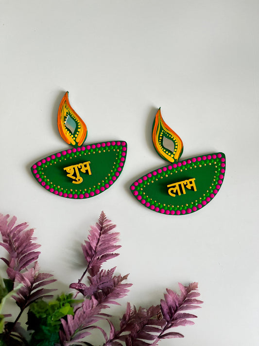 Handpainted Shubh Labh Wall Hanging – Diya Design in Pink, Green & Orange (Approx. 3x5 Inch)